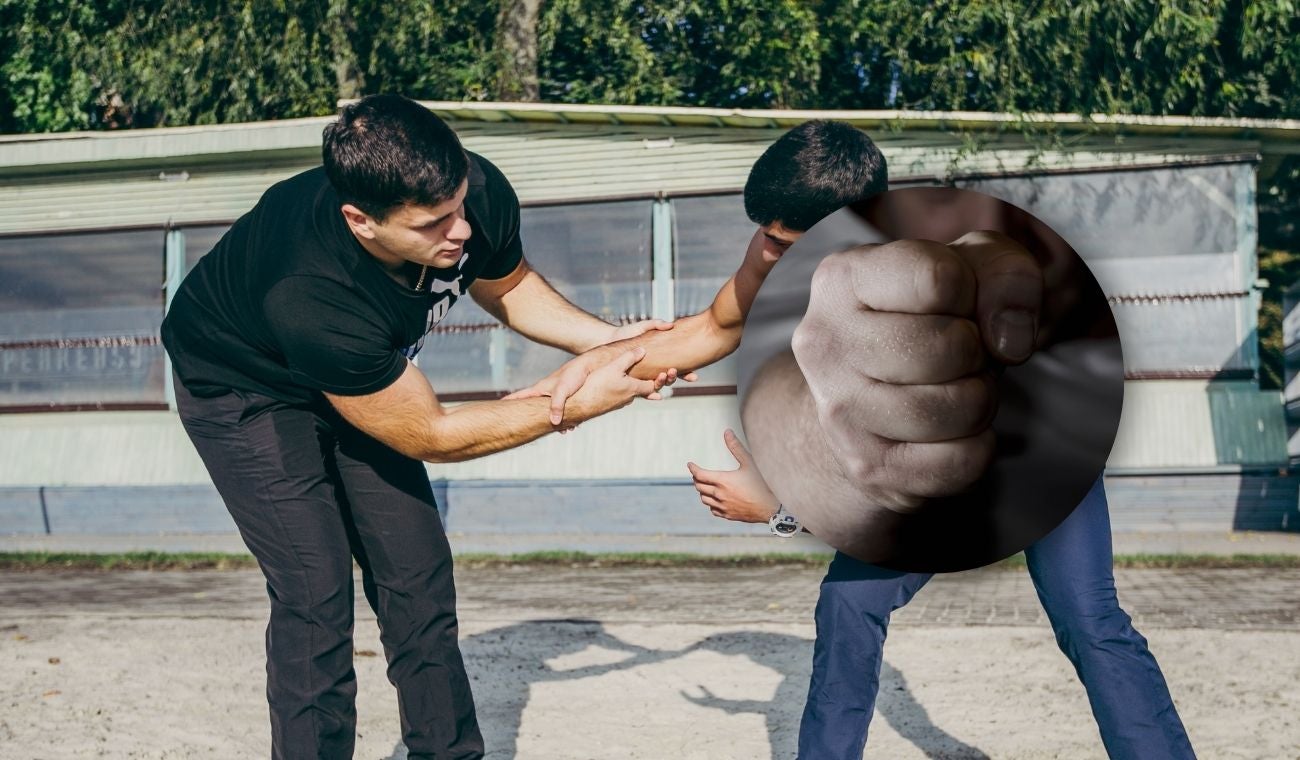 Hombres peleando a puños