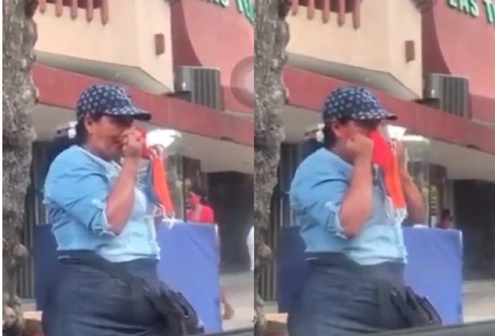 Mujer se limpia con los tapabocas, en Santa Marta