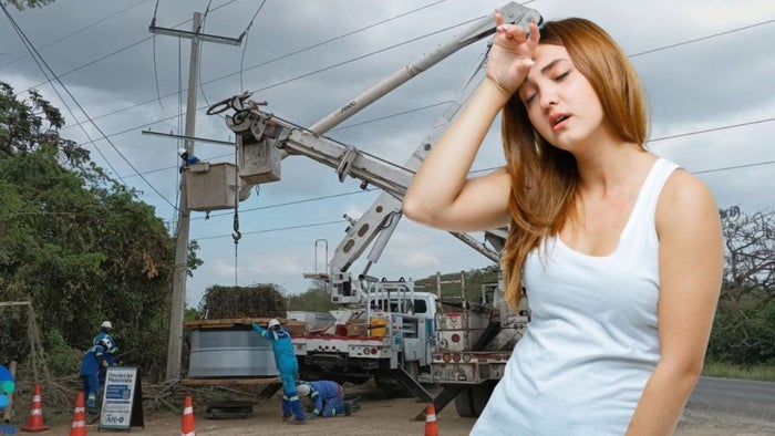 Técnicos de Air-e (fondo) - mujer con calor