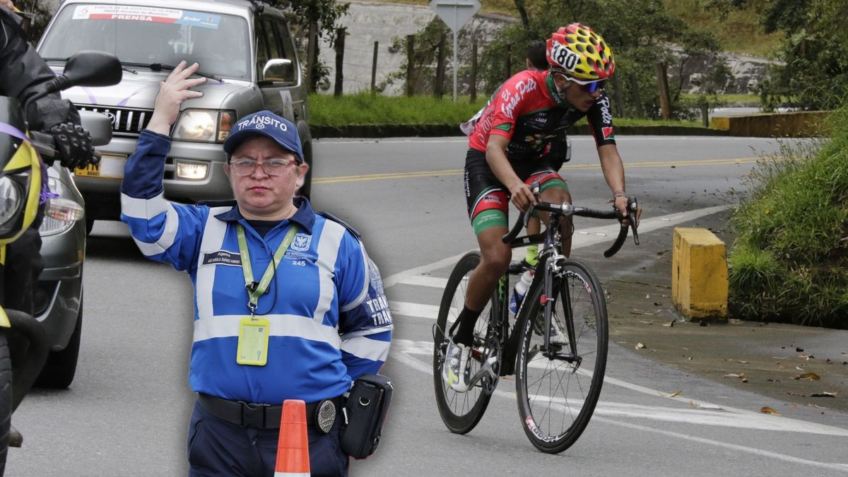 Ciclista en carrera y agente de tránsito